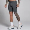 MP miesten Hybrid Pocket puolipituiset shortsit - tummanharmoninen/vihreä